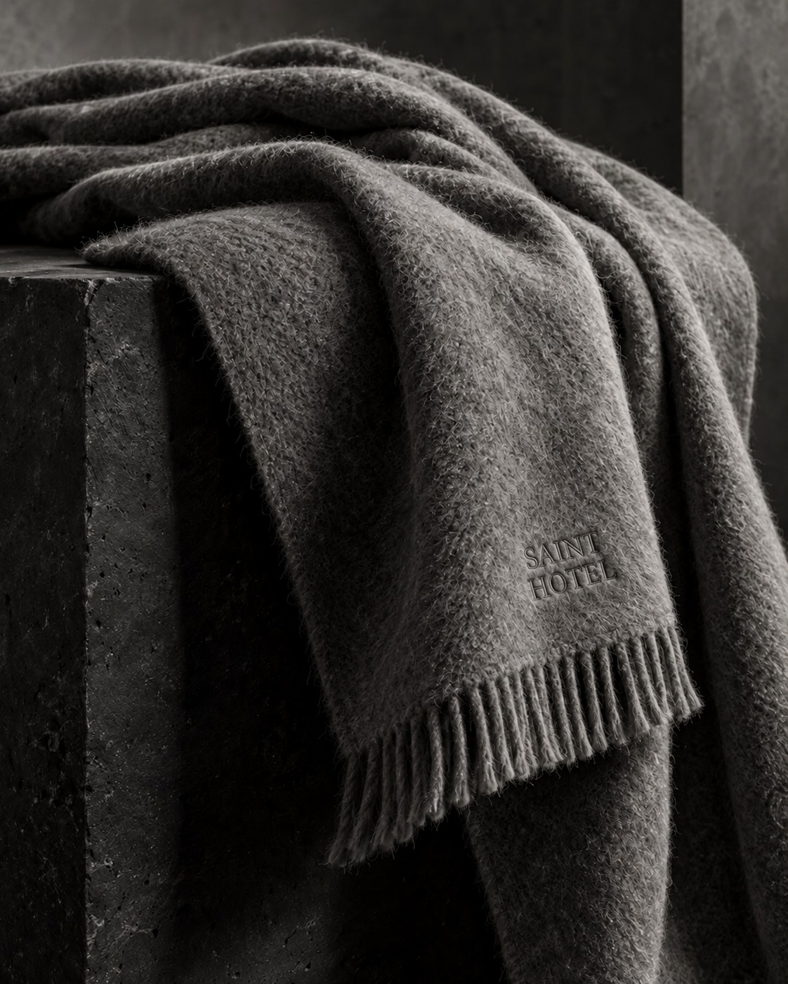 Alpaca blanket editorial concept with discreet tonal SAINT HOTEL embroidery